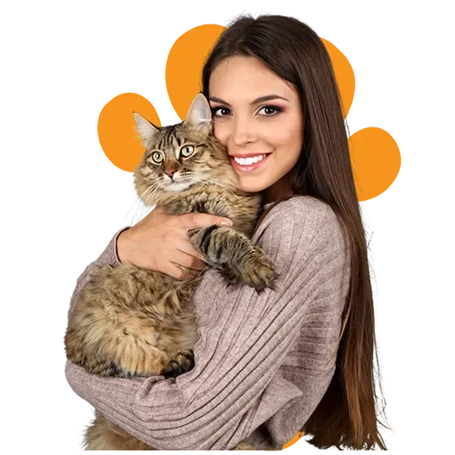 Woman smiling and cuddling her cat