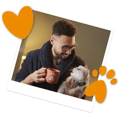 A man cuddling his cat