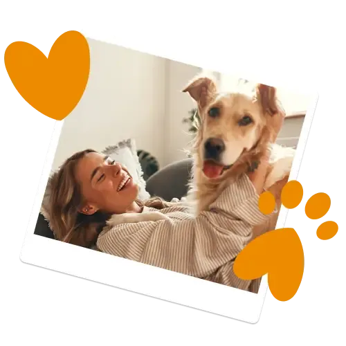 A laughing woman and her golden retriever