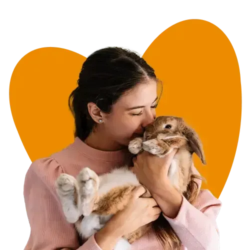 A woman snuggling her bunny rabbit