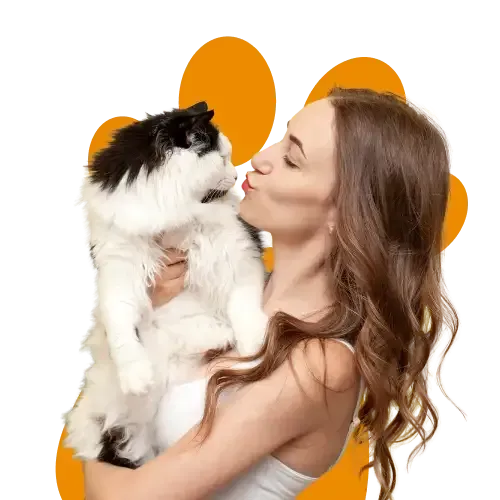A woman kissing her fluffy white cat
