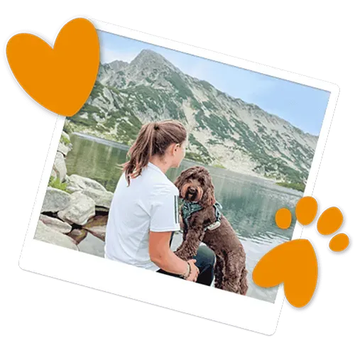 Woman and a dog checking out the view on holiday